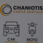 Sign for Chaniotis Paros Rentals with car and motorcycle icons labeled CAR and MOTO beneath the logo.
